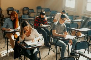 Students studying seriously in a Buenos Aires classroom setting during the day.